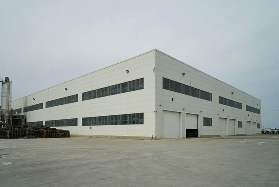 Exterior of a large factory in an industrial sector in Bromont.
